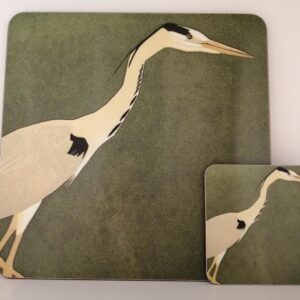 Matching placemat and coaster set featuring a white heron illustration on a muted green background.