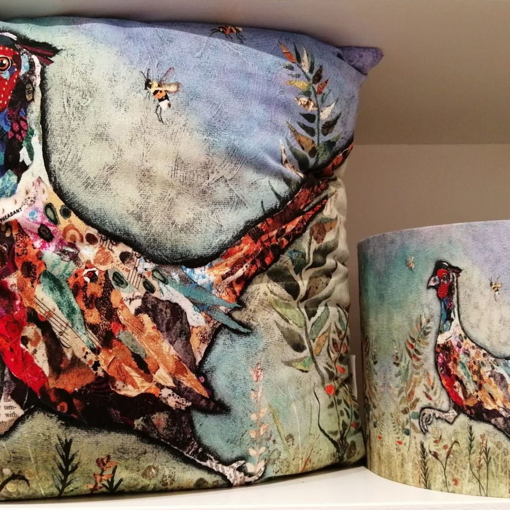 Matching cushion and lampshade featuring colourful illustrated pheasant artwork with botanical details.